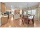 Open kitchen and breakfast area with wooden cabinets and stainless appliances at 1730 Millhouse Run, Marietta, GA 30066
