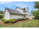 Exterior of home featuring an expansive backyard with healthy green landscaping and a cozy patio at 175 Fenwyck Commons, Fayetteville, GA 30214