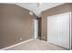 Spacious bedroom featuring carpeted floors, double door closet, neutral paint, and a ceiling fan at 175 Fenwyck Commons, Fayetteville, GA 30214