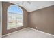 Bright bedroom with neutral walls, carpeted floors, ceiling fan and a large window offering natural light at 175 Fenwyck Commons, Fayetteville, GA 30214