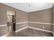 Dining room with dark paint, hardwood floors, trim work, and access to the kitchen at 175 Fenwyck Commons, Fayetteville, GA 30214
