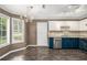 Eat-in kitchen area features lots of natural light, an ornate chandelier, and stainless steel appliances at 175 Fenwyck Commons, Fayetteville, GA 30214