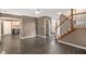 Open living area showcasing the staircase and an entrance to the kitchen at 175 Fenwyck Commons, Fayetteville, GA 30214