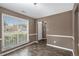 Living Room with dark paint, hardwood floors, trim work, and large windows allowing for lots of natural light at 175 Fenwyck Commons, Fayetteville, GA 30214