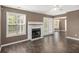 Bright living room with wood floors, fireplace, and French doors leading to the outside at 175 Fenwyck Commons, Fayetteville, GA 30214