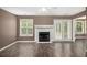 View of the living room with wood floors, a fireplace, and French doors at 175 Fenwyck Commons, Fayetteville, GA 30214