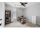 Bedroom with a built-in bookshelf, a window and neutral carpeting at 701 Rockingham Ct, Woodstock, GA 30189