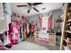 Large walk-in closet with ample clothing storage and decor at 701 Rockingham Ct, Woodstock, GA 30189