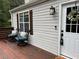 Comfortable deck area with seating, offering a relaxing outdoor space at 701 Rockingham Ct, Woodstock, GA 30189