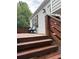 Inviting deck with wooden steps and seating, perfect for enjoying the outdoors at 701 Rockingham Ct, Woodstock, GA 30189