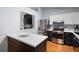Modern kitchen featuring stainless steel appliances, dark cabinets, and quartz countertops at 701 Rockingham Ct, Woodstock, GA 30189