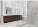 Elegant bathroom with marble floors, double vanities, and a glass-enclosed shower at 210 Regester Way, Peachtree City, GA 30269
