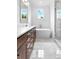 Well-lit bathroom with modern fixtures, a standalone tub, and a glass-enclosed shower at 210 Regester Way, Peachtree City, GA 30269