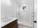 Bright bathroom featuring a glass-enclosed shower with white tiles and a sleek vanity at 210 Regester Way, Peachtree City, GA 30269
