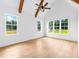 Spacious bedroom featuring vaulted ceilings, wooden beams, and an abundance of natural light at 210 Regester Way, Peachtree City, GA 30269