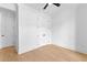 Bright bedroom features a ceiling fan, light walls, and a large closet near a white door at 210 Regester Way, Peachtree City, GA 30269