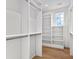 Walk-in closet with custom shelving and ample storage, illuminated by natural light at 210 Regester Way, Peachtree City, GA 30269