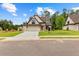 Charming home with a stone facade, large garage, and well-manicured front lawn at 210 Regester Way, Peachtree City, GA 30269