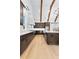 Spacious kitchen features wooden beams, stainless appliances, white subway tile, and a kitchen island at 210 Regester Way, Peachtree City, GA 30269