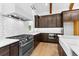 Modern kitchen features stainless steel appliances, white countertops, subway tile backsplash, and custom wood cabinets at 210 Regester Way, Peachtree City, GA 30269