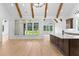 Open-concept kitchen featuring modern appliances, hardwood floors, a large island and great natural light at 210 Regester Way, Peachtree City, GA 30269