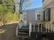 Back view of home shows back porch, yard and condition needing repair at 2284 Beecher Sw Cir, Atlanta, GA 30311