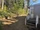 Backyard with partial fence, wooden steps and condition needing repair at 2284 Beecher Sw Cir, Atlanta, GA 30311