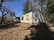 Side of home with covered porch, windows and condition needing repair at 2284 Beecher Sw Cir, Atlanta, GA 30311