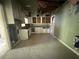 Kitchen view showcasing layout, cabinetry, tile floors and needed repairs at 2284 Beecher Sw Cir, Atlanta, GA 30311