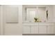 Modern bathroom featuring a double vanity, white cabinets, and stylish decor for a clean and refreshing space at 2489 Cotton Ln, Douglasville, GA 30135
