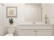 Bright bathroom featuring white vanity, neutral artwork, and modern decor, offering a clean aesthetic at 2489 Cotton Ln, Douglasville, GA 30135