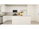 Bright kitchen featuring white cabinets, granite countertops, stainless steel appliances, and a central island at 2489 Cotton Ln, Douglasville, GA 30135