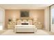 Serene main bedroom featuring a king-size bed, nightstands, lamps, and a soothing color palette at 2489 Cotton Ln, Douglasville, GA 30135