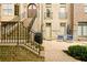 Inviting outdoor brick patio with a seating area and beautifully landscaped surroundings at 538 Micayne Cir # 3, Smyrna, GA 30082