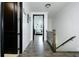Hallway with dark hardwood floors leads to an open living space at 538 Micayne Cir # 3, Smyrna, GA 30082