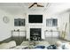 Cozy living room with a fireplace, mantel, and large screen tv at 538 Micayne Cir # 3, Smyrna, GA 30082