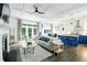 A well-lit living room flows seamlessly into the kitchen with a fireplace and hardwood floors at 538 Micayne Cir # 3, Smyrna, GA 30082