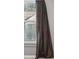 Bedroom view featuring natural light from the window and a dark, stylish curtain at 7492 Ferrara Dr, Lithonia, GA 30058