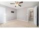 Neutral bedroom with carpet, ceiling fan, and attached bathroom at 7492 Ferrara Dr, Lithonia, GA 30058
