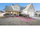 Inviting two-story home with a charming front porch and a two car garage at 7492 Ferrara Dr, Lithonia, GA 30058