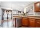 Kitchen view highlighting stainless steel dishwasher, countertops, and open layout at 7492 Ferrara Dr, Lithonia, GA 30058