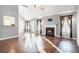 Bright living room with hardwood floors, fireplace and abundant natural light at 7492 Ferrara Dr, Lithonia, GA 30058