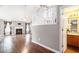 Bright living room featuring vaulted ceilings, fireplace, hardwood floors, and staircase at 7492 Ferrara Dr, Lithonia, GA 30058