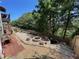 A terraced backyard showing off its fire pit area and meticulously designed layout at 140 Puckett Creek Dr, Canton, GA 30114