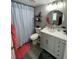 Modern bathroom with a gray vanity, round mirror, and a curtained shower at 140 Puckett Creek Dr, Canton, GA 30114