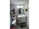 Well-lit bathroom with a gray vanity, circular mirror, and modern fixtures at 140 Puckett Creek Dr, Canton, GA 30114