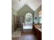 Bright bathroom featuring a separate tub, a glass door shower, and large windows at 140 Puckett Creek Dr, Canton, GA 30114