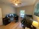 A bedroom with a desk covered in computer monitors and a green gaming chair at 140 Puckett Creek Dr, Canton, GA 30114