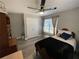 Bedroom with ceiling fan, closet, and window, creating a cozy and functional space at 140 Puckett Creek Dr, Canton, GA 30114