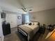Neutral bedroom with a ceiling fan, white doors, and luxury vinyl plank flooring at 140 Puckett Creek Dr, Canton, GA 30114